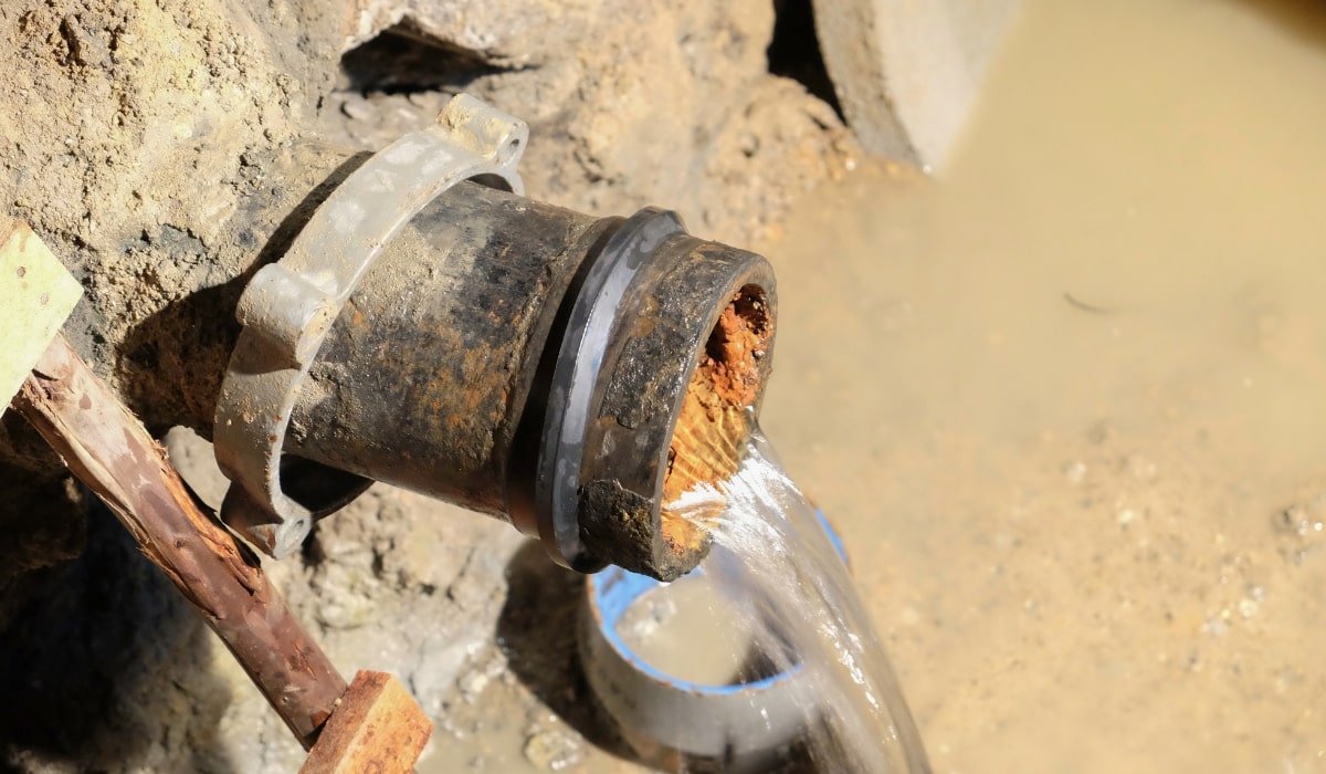 open pipe with scale buildup and slow water flow